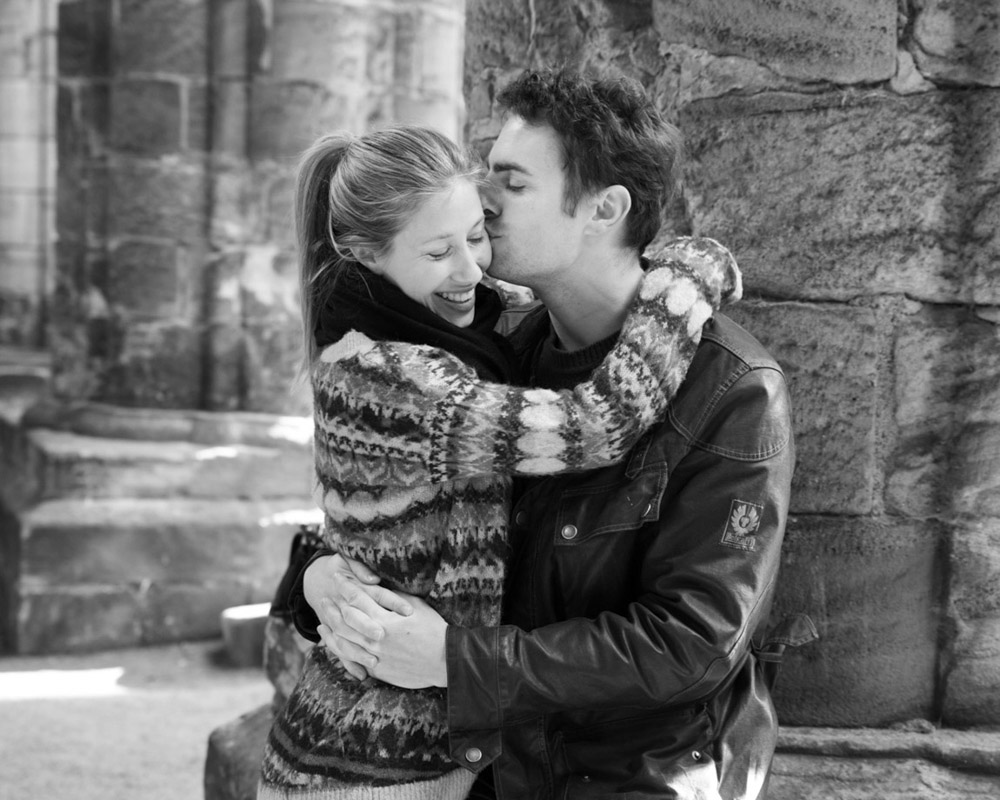 Zoe and Andrew during their engagement session at Kirkstall Abbey in Leeds—an intimate monochrome portrait captured naturally by a respected Leeds wedding photographer.
